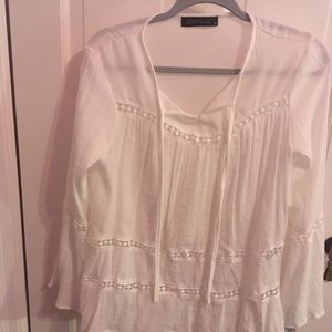 White, lacy, flowy shirt